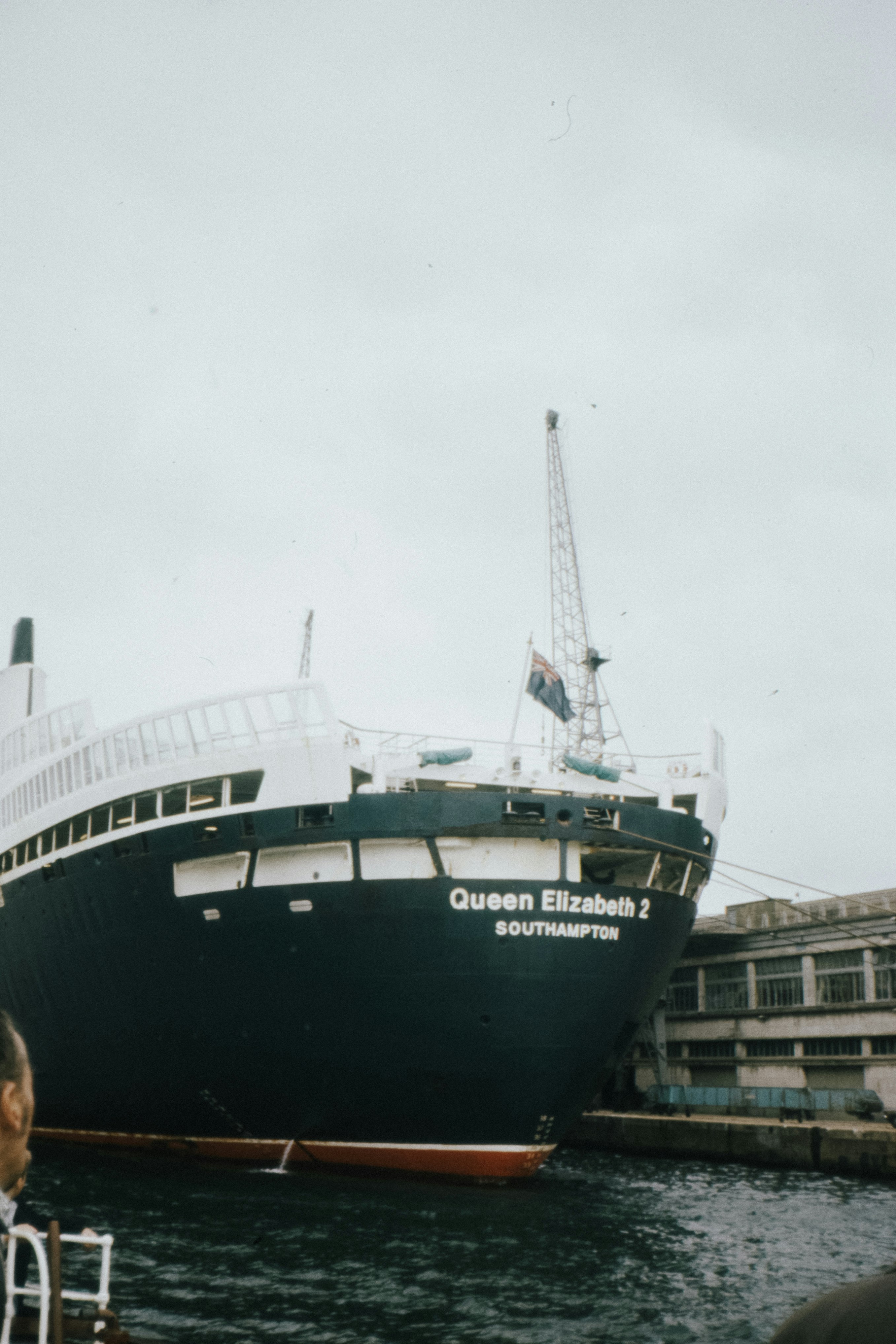 green and white ship on dock during daytime